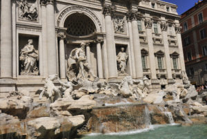 Fountain with intricate sculptures depicting mythological figures, emphasizing the historical significance of water movement in urban settings, reflecting the evolution of plumbing from ancient Rome.